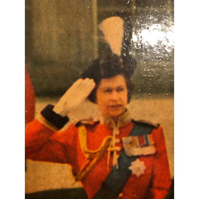 Beautiful photographic poster of a young Queen Elizabeth II Taking a Salute Outside Buckingham Palace with her family...