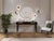 Handcrafted in Italy, this console table features a black-brown lacquer finish with Makassar ebony veneer drawer fronts...