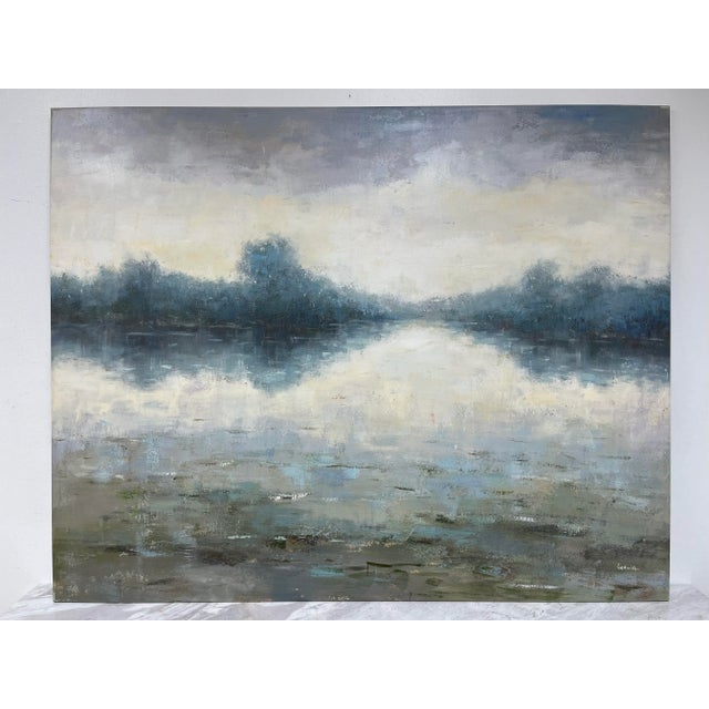 A stunning impressionistic landscape oil painting on canvas, featuring a serene waterscape with a soft blend of blues,...