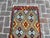 Brighten up your hallway or any narrow space with this vibrant handwoven wool kilim runner rug. Featuring a colorful...