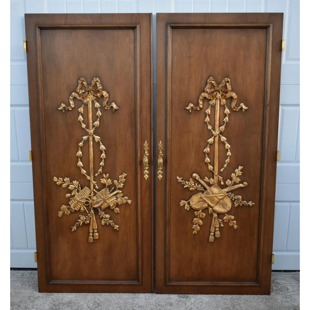 Vintage (1960s) Pair of Doors have a Regency Style. The Doors are Wood. Carved & Gilded. The Finish is Brown with Gold...