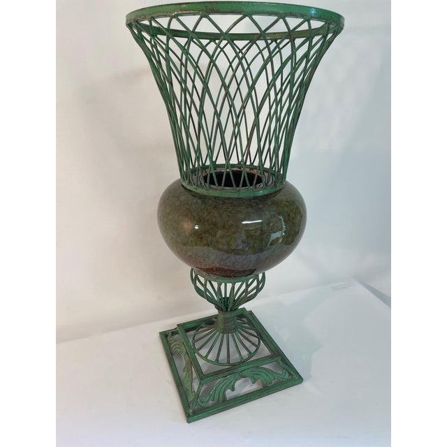 A striking and unique vintage Urn style planter or cachepot from circa 1980s. This decorative planter features a light...