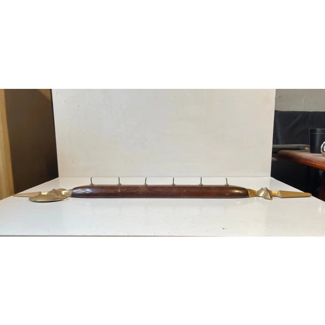 Decorative large key or dishtowel hanger in shape of an axe. It has 6 hooks and its made from brass and lacquered...