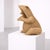 An original frog-shaped woven rattan magazine rack, attributed to Mario Lopez Torres and made in Italy, featuring a strong...
