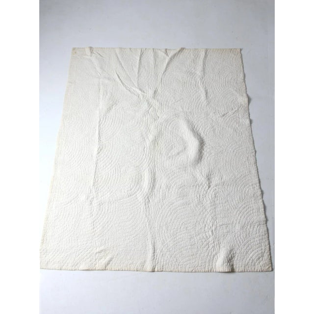 Vintage handmade Sunbonnet Sue quilt featuring the beloved early 20th-century appliqué pattern of a bonneted little girl...