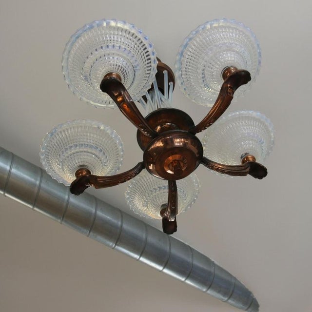 Art deco chandelier, circa 1930, a masterpiece of the interwar period. Typical of the modernist style with its airy lines,...