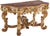Early nineteenth century Italian large scale painted giltwood console table with faux marble top and ornate carvings....