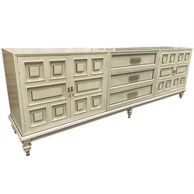 This unique designed vintage piece is solid wood and has great storage along with unique design element on the doors and...