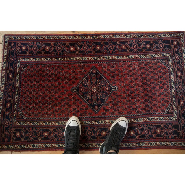 :: Diamond shaped center medallion with minor arrowed finials atop a covered boteh main field comprised of staggered rows...