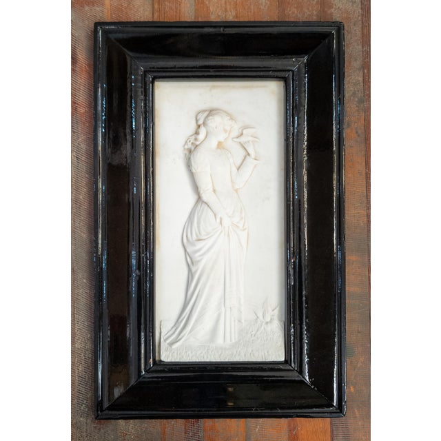 We are selling this pretty late Victorian carved marble plaque. This plaque features a medium bas relief carving of a lady...