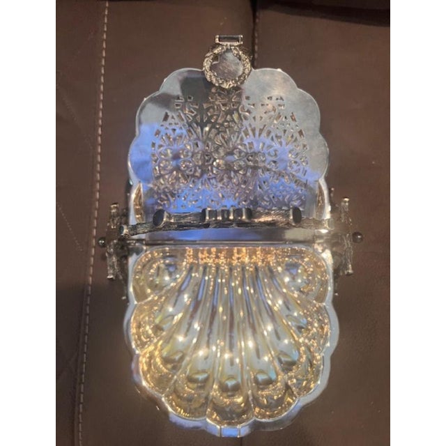 This elegant 19th-century serving dish was designed to keep biscuits or crumpets warm on the breakfast table. It features...
