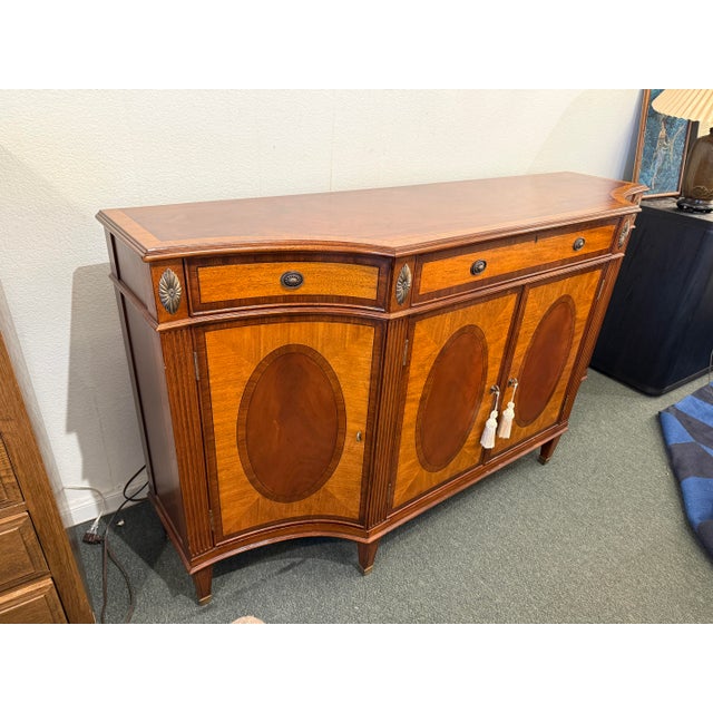 Design Plus Gallery presents the Easton Sideboard from the Newport Collection of Ethan Allen. Behold the sinuous style...