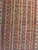 Circa 1900 Russian Caucasian tribal rug featuring a striking vertical stripe field with repeating geometric motifs in deep...