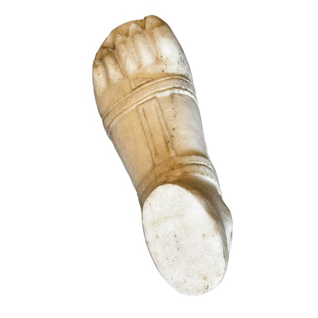 A striking 19th century carved marble sculpture of a Greco-Roman gladiator’s foot, masterfully rendered with anatomical...