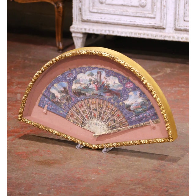 Decorate a wall or salon with this elegant antique framed fan, crafted in France circa 1870. Presented within a refined...