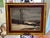 A stunning 1960 oil painting in a solid wood gold leaf frame. This painting depicts a winter scene with an overcast sky,...