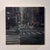 City #5 by Jim Beckner | Oil on panel Nighttime city street scene with traffic and buildings. For Sale