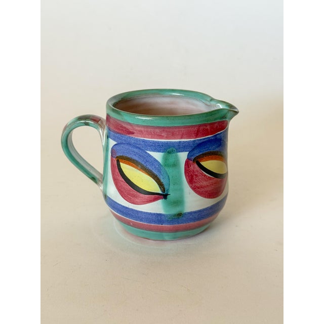 Vintage Creamer from Tintagel Pottery in Cornwall, showing the Dragon Eye pattern in the glaze. This is a stunning piece...