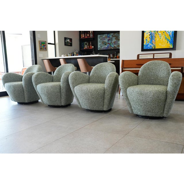 An exceptional and increasingly collectible set of four original “Miami” swivel lounge chairs designed by Michael Wolk,...