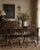 A set of four antique Windsor-style dining chairs, showcasing the enduring appeal of classic American furniture design....