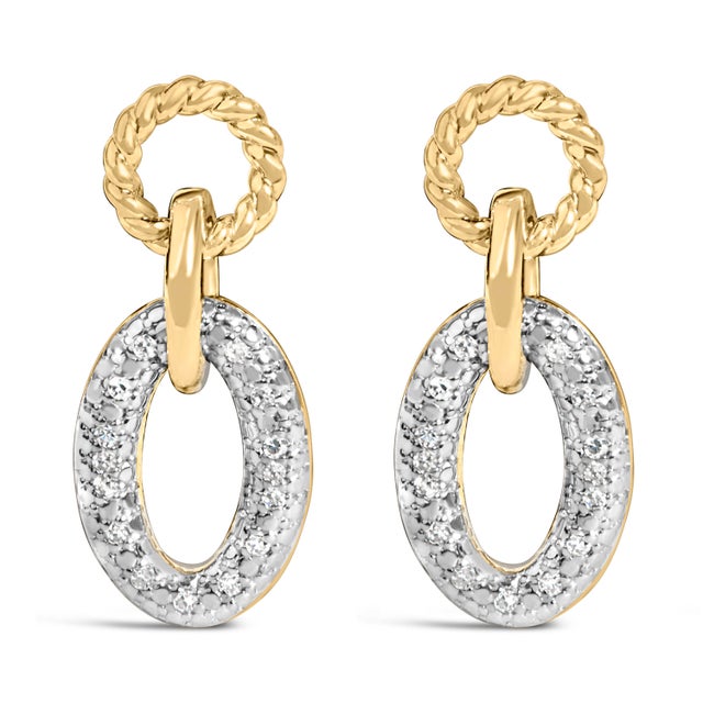 Light dances across every curve of these lyrical drop studs, where a petite rope‑textured circle nestles at the lobe and a...
