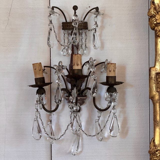 This is a pair of Giltwood and crystal sconces. A beautiful pair.