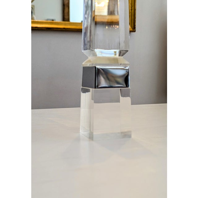 Sleek and sophisticated, this vintage Lucite and chrome obelisk captures the spirit of 1970s minimalist design. Crafted...
