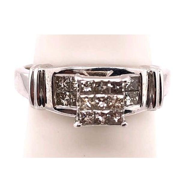 14Kt white Gold Contemporary Ring 1.00 Total Diamond Weight Size 5.75 with 3.72 grams total weight.