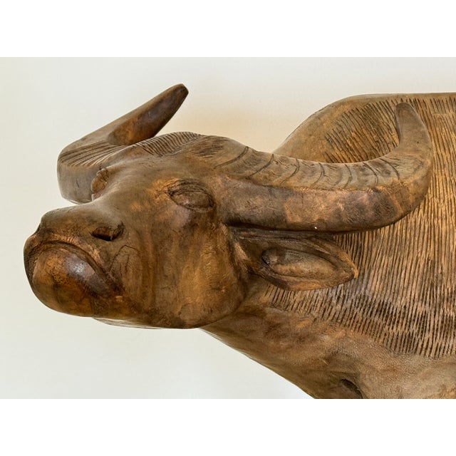 A wood carving of. Water Buffalo. Finely executed. Japanese from the early 20th century.
