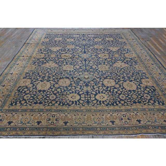 A magnificent and uniquely proportioned Antique Persian Tabriz carpet, circa 1880. Measuring 11' x 11' 7", this nearly...