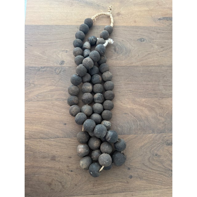 Pair of Mid-Century African clay beads. This set of vintage beads includes two (2) strands, and consists of circular clay...