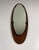 Beautiful wall mirror by Mobili Polli, Italy (marked). Oval in the length bended teak wooden back, oval mirror glas...