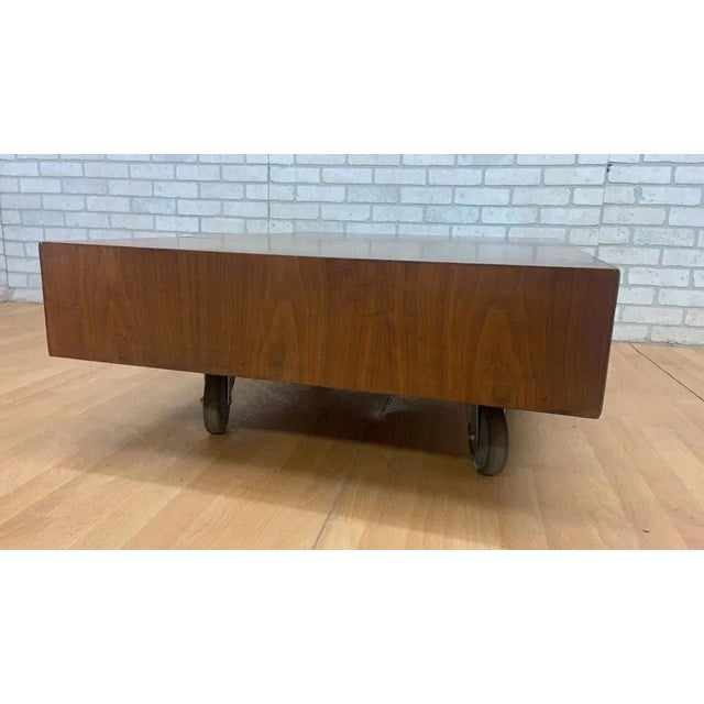 Vintage Mid Century Modern Walnut Coffee Table Designed By Kipp Stewart for Drexel This low rectangular shaped table has...