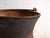This antique copper cauldron is a kitchen vessel of hammered copper with an iron handle. It originates from central...