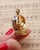 Swiss gold musical fob seal in 18 karat gold. Antique seal decorated with champlevé enamel flowers in a vase, in light...