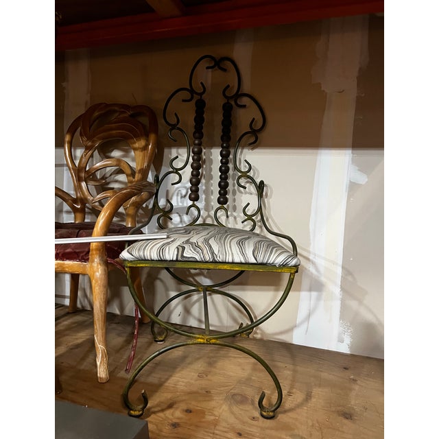 Up for consideration is a beautiful vintage iron Giacometti style metal chair with wooden abacus details. This would look...