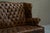 English Tufted Wingback Settee in Patinated Leather, 1900 For Sale - Image 3 of 17