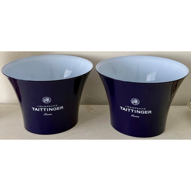 Rare matching pair of vintage Taittinger Champagne advertising ice buckets.These sleek, flared buckets feature a deep...