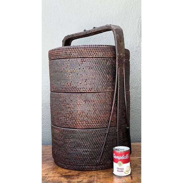 This monumental vintage Asian wedding basket is a masterclass in traditional hand-woven artistry and functional...
