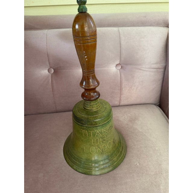 Decorative Large Titanic 1912 London hand bell with a solid metal bell and turned wooden handle. Made in India with an...
