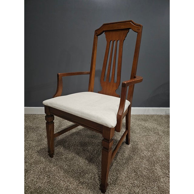 This elegant mid-century armchair (Model 413-37-450) was manufactured by the renowned Bassett Furniture Industries, Inc....