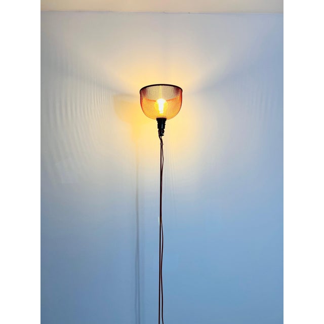 This striking 1970s Italian floor lamp captures the bold, futuristic aesthetics of Space Age design. The lamp features a...