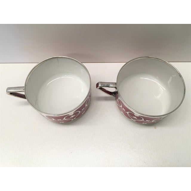 20th pair of Hutschenreuther handled Art Decó small porcelain cups decorated in silver.
