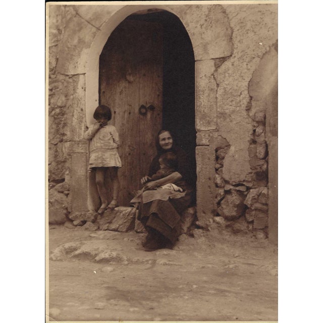 A sepia tone black and white photograph of figures on a European street, probably Italy or Greece. Unsigned, combined...