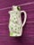 This adorable pitcher is in the form of a sleepy frog with polka dots. Manufactured by Schmid Design