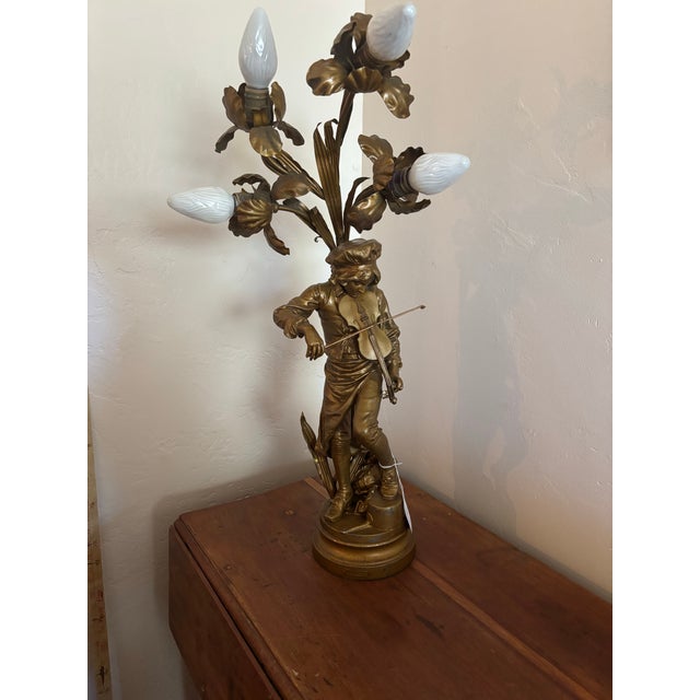 Early 20th century Antique Adrien Etienne Gaudez "Lulli Enfant" Figural Newel Post Lamp with multi-bulb floral spray. Has...