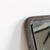Tall sculptural Modernist mirror by artist Lorenzo Burchiellaro. Textured cast aluminum. Signed Burchiellaro.