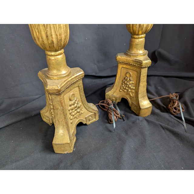 Pair of gilded terracotta candlestick lamps, copies of neoclassical altar candlesticks. 24" to top of candlestick....