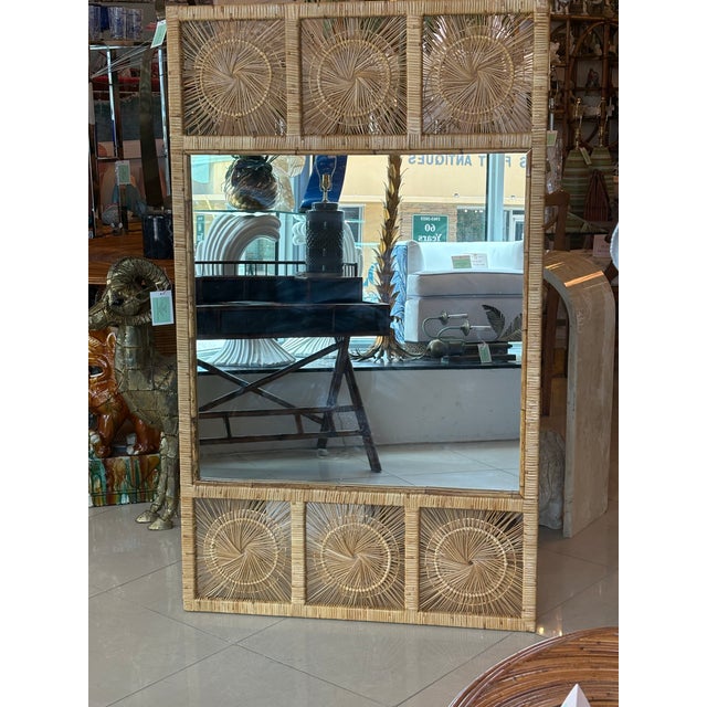 Vintage large woven rattan, spun wicker wall mirror. Dimensions: 60 H x 36 W x 1.5 D. Wicker is in excellent condition but...