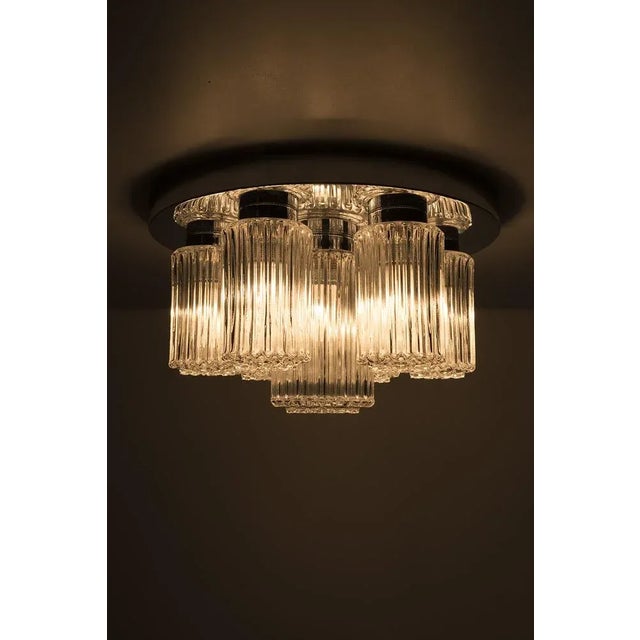 Wonderful chrome ceiling light with 7 lamps. In good vintage condition. Measurements H. 27 cm; Ø 40 cm. Up to 250V...